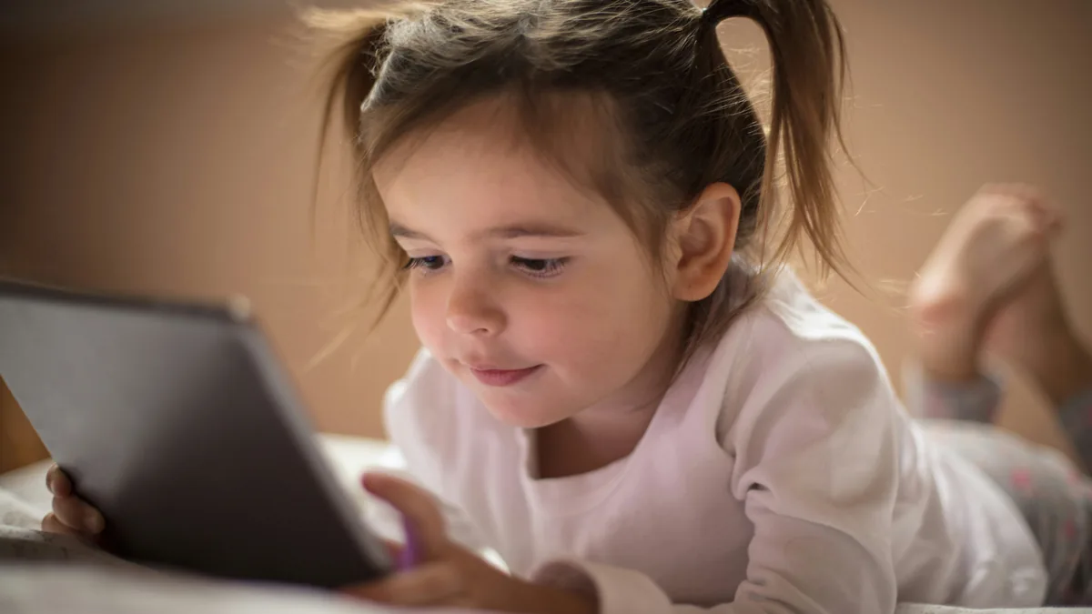 Young child playing on a tablet – Google Play children's privacy class action