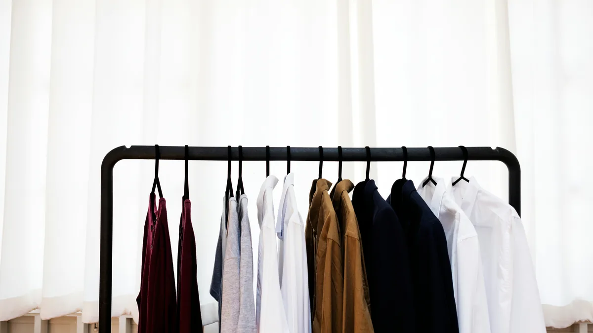 Women's shirts and jackets hanging on a clothing rack – Ann Taylor Factory and Loft Outlet class action