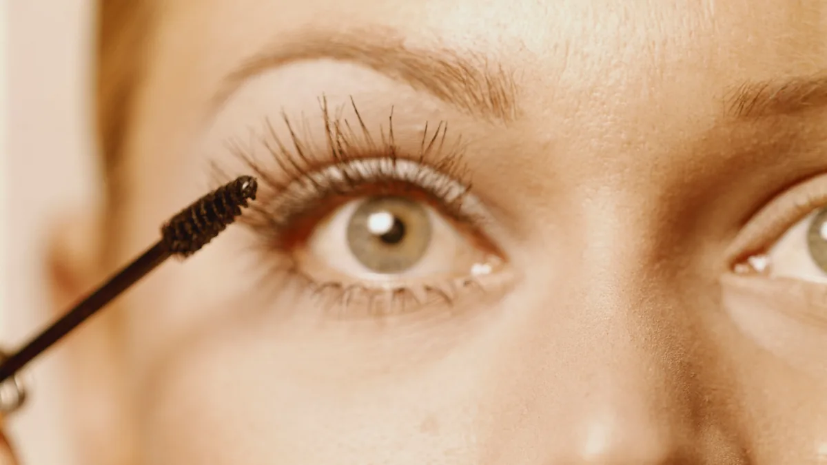 Mascara wand next to long eyelashes – RevitaLash eye serum class action