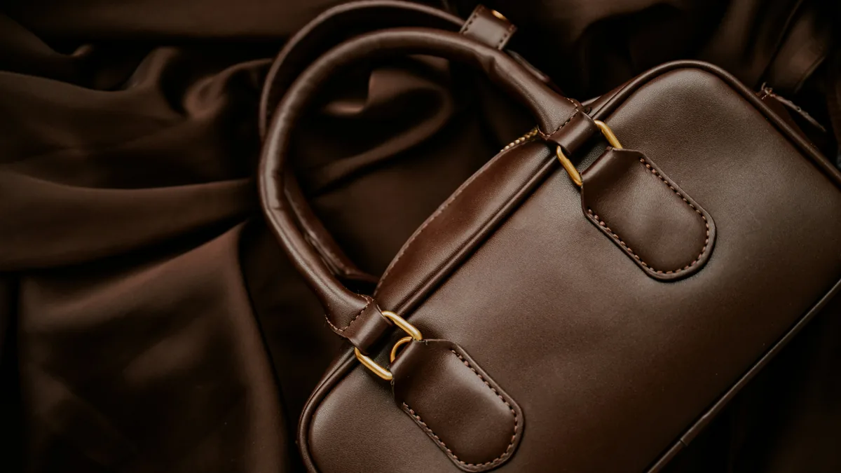 Brown leather handbag on dark fabric – Christian Dior data breach class action