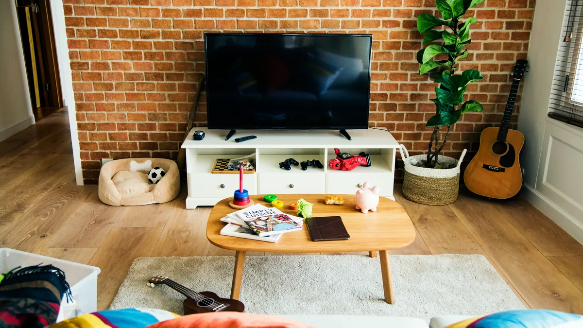 Living room with a television on a white media unit – DirecTV Stream class action