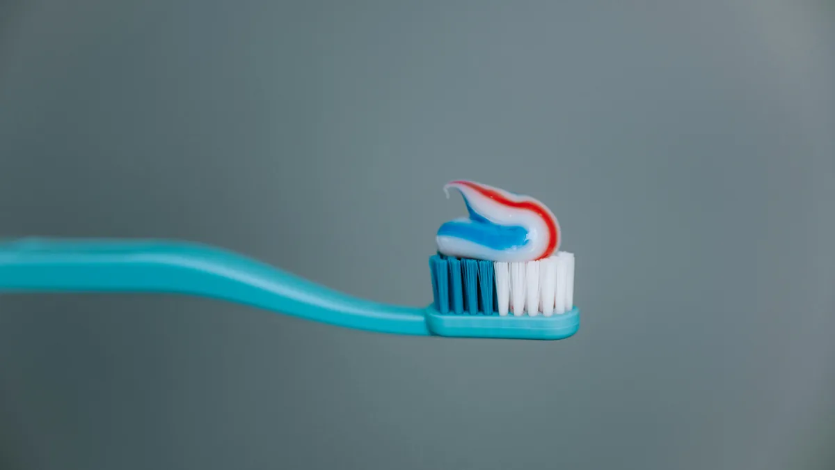 Toothbrush with striped toothpaste on the bristles – Tom's of Maine toothpaste class action